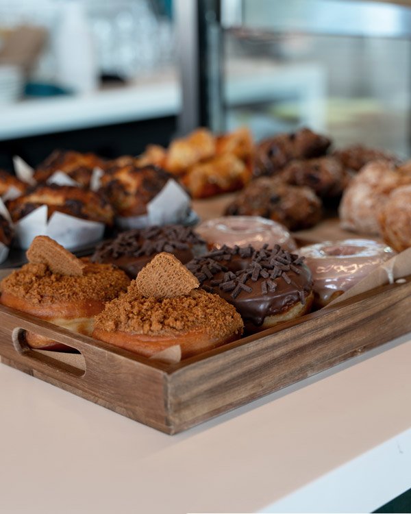 Fresh donuts and muffins on display
